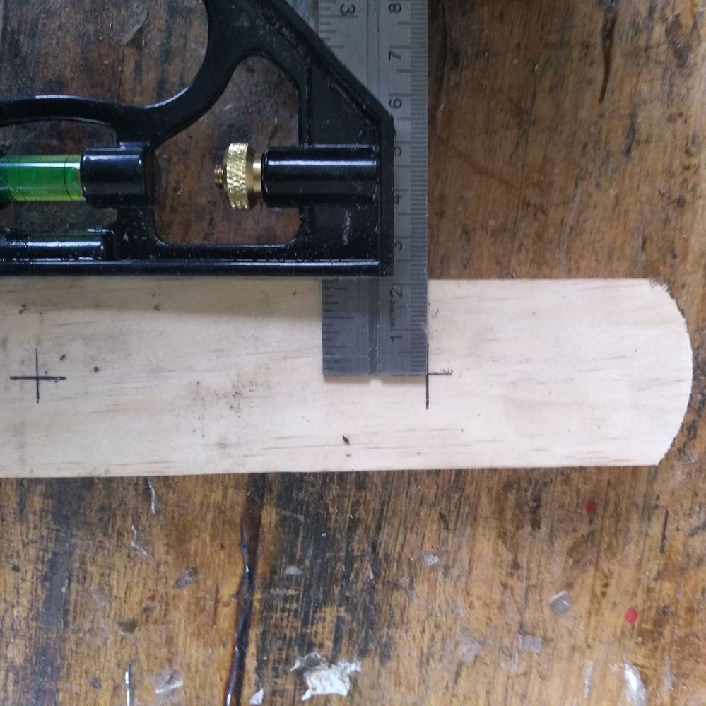 2.3 Marking hole location on hangers.jpeg