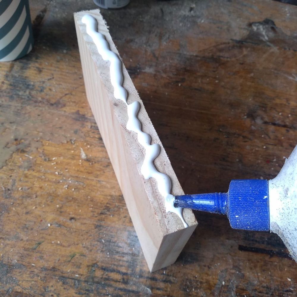 3.1 Applying glue to divider.jpeg