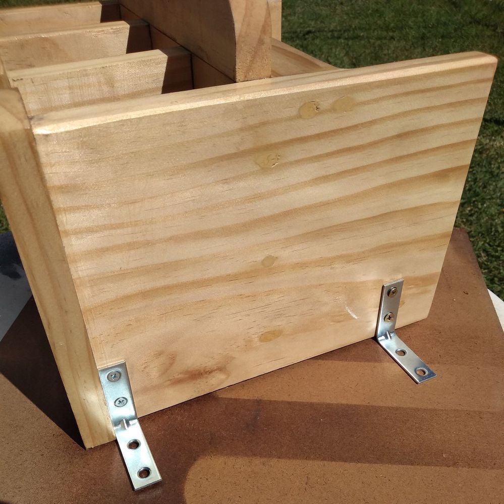 10.2 Attaching mounting brackets to charging station.jpeg