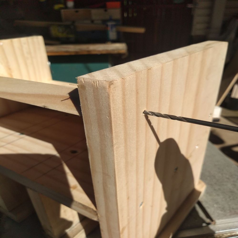 7.4 Pre-drilling through side panel into shelf.jpeg