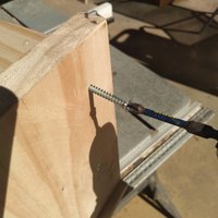 7.5 Fixing screws through side panel into shelf.jpeg