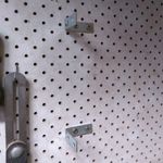 10.3 Attaching brackets to wall.jpeg