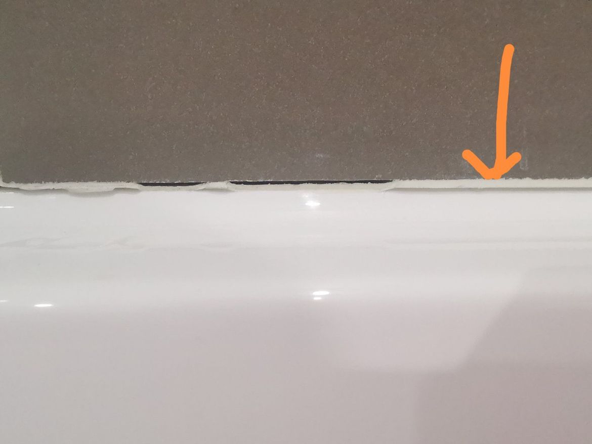 between tile and bath tub.jpg
