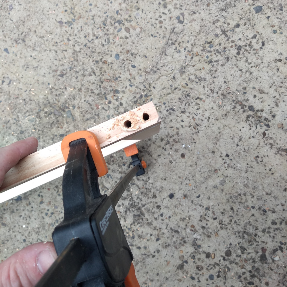 8.3 Screwing pegboard surround together.png