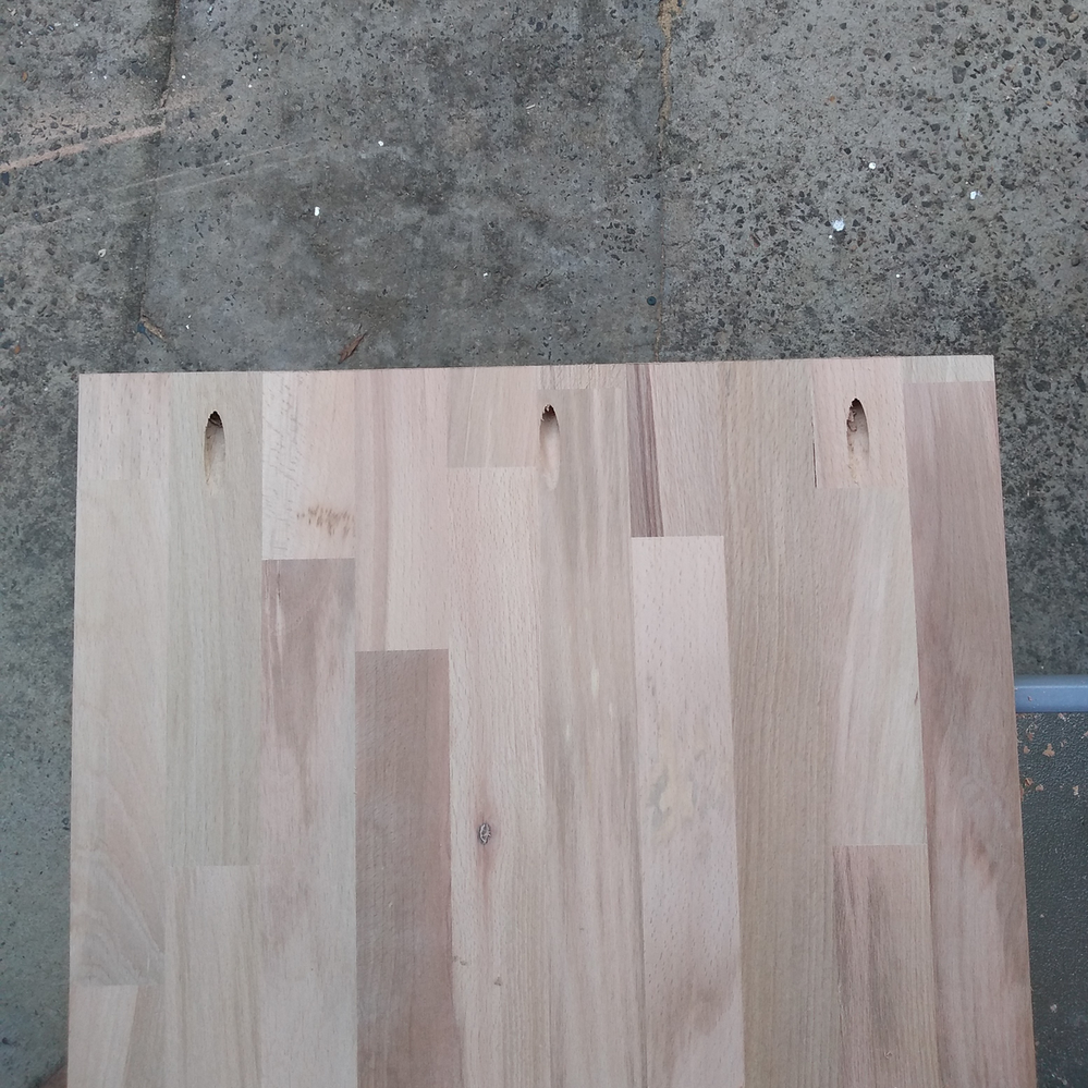 2.5 Top mounting holes drilled in upright board.png