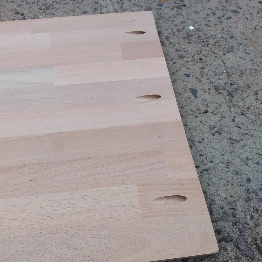 2.6 Top mounting holes drilled in upright board.png