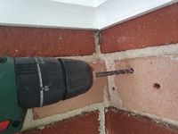 Drill holes using a masonry drill bit