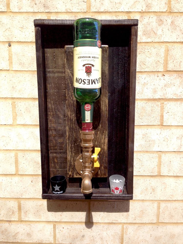 Made from pallets, painted galvanised fittings brass, Home made stain then a clear coat of varnish