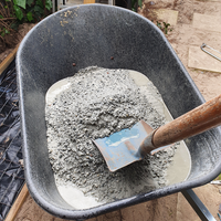 6.3 - Beginning mixing the concrete by turning over shovels full of mix.png