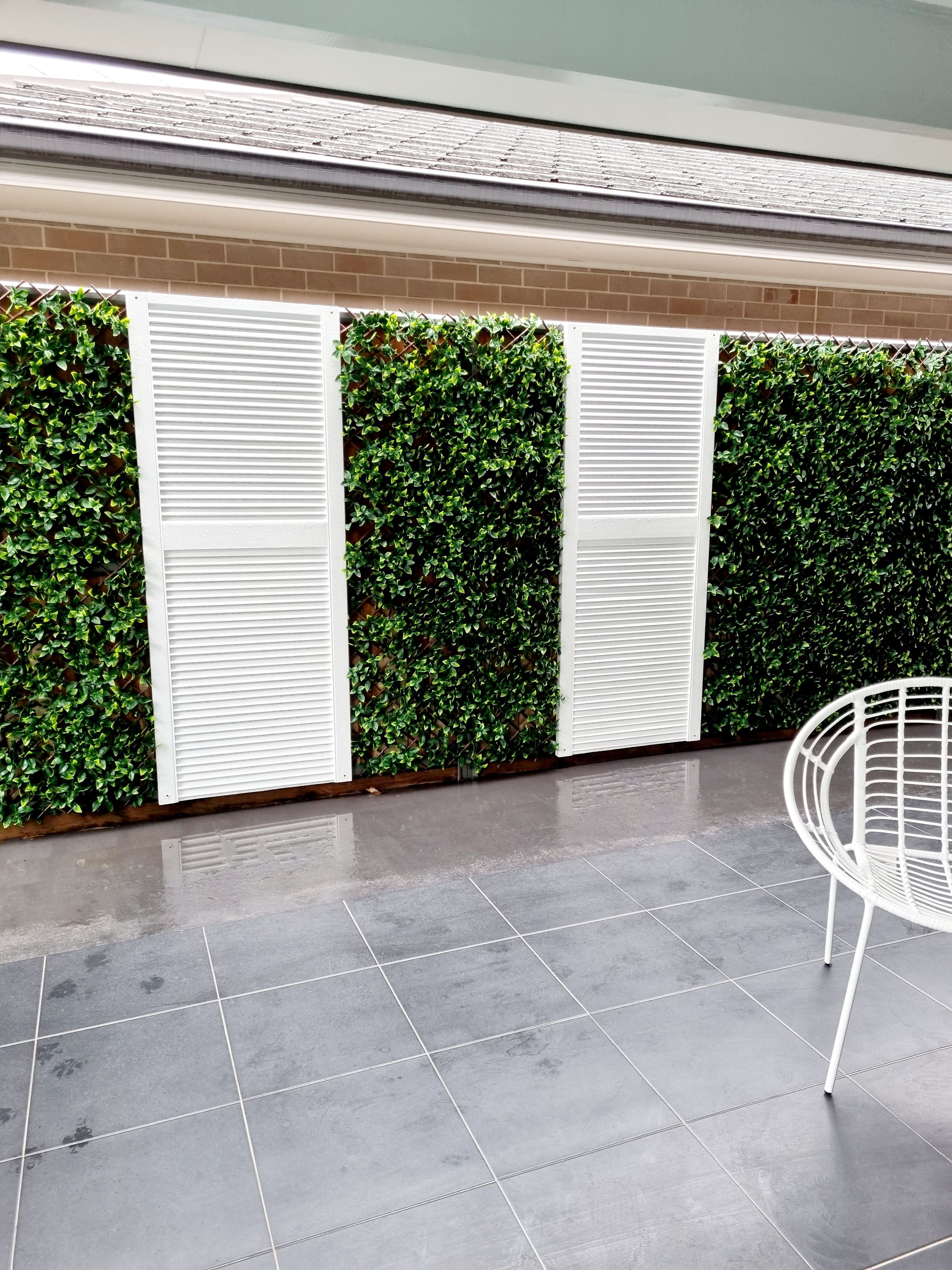 Artificial hedge outdoor feature wall Bunnings community