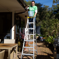 A multi-purpose ladder used open as a double-sided step ladder