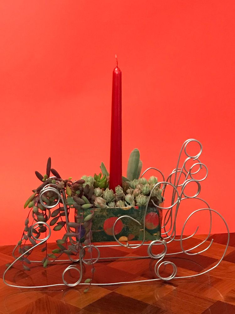 With succulents. The problem, is if multiple candles are used, people will bet on with candle causes the rest to catch fire first.