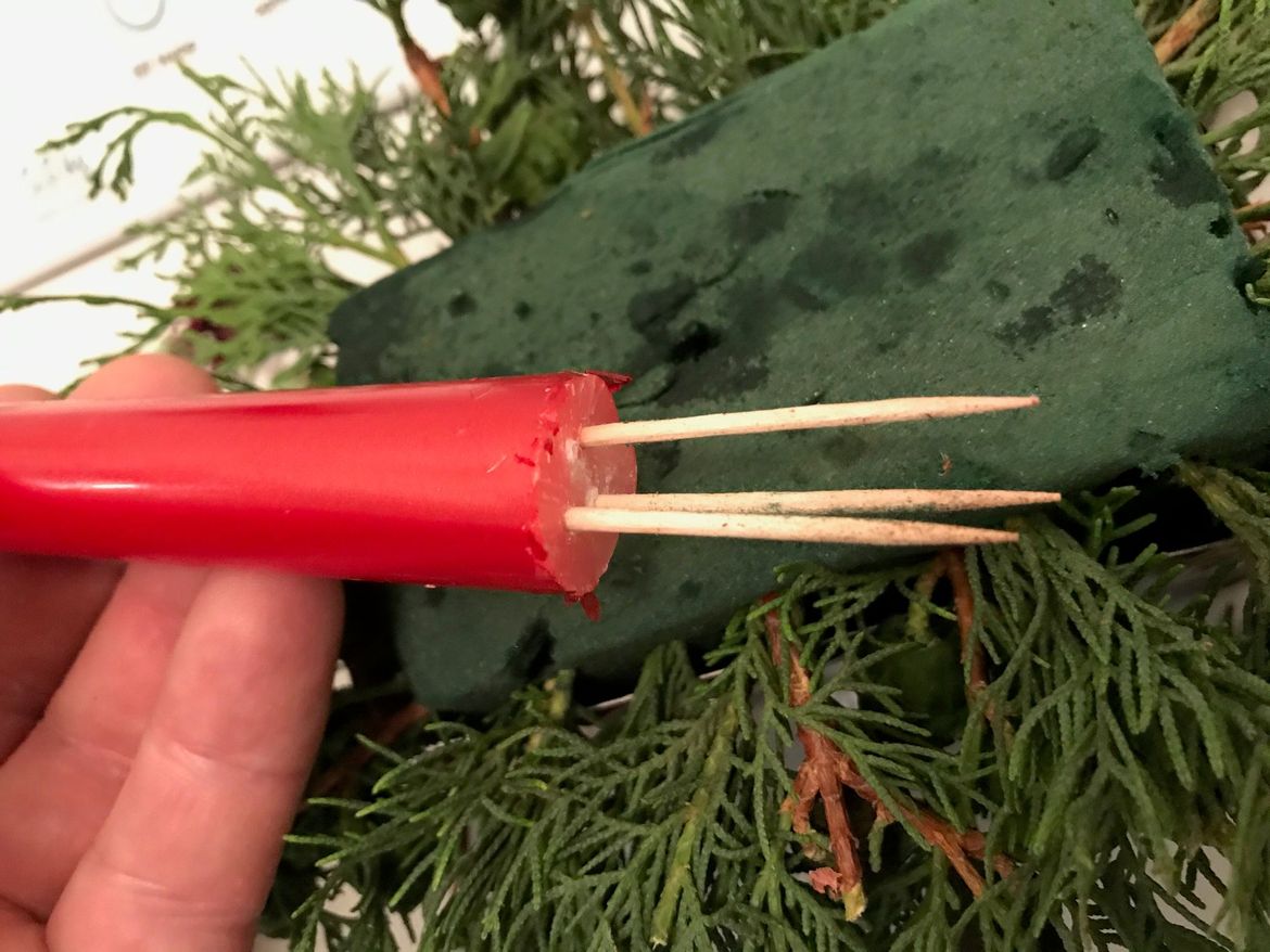 To mound the candle, tooth picks have been used, and inserted into holes made with a drill.