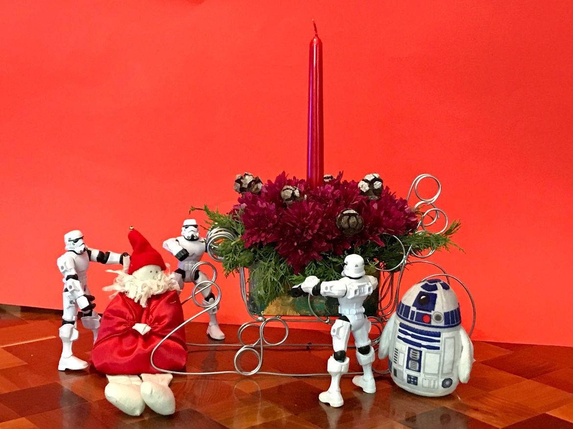 Opps, looks like Santa has an incident involving the sleigh. The Star Wars characters are on hand to help out.