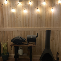Centrepiecefurn hung lights on outdoor timber screening