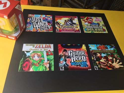 Old game covers, laminated and glued to adhesive