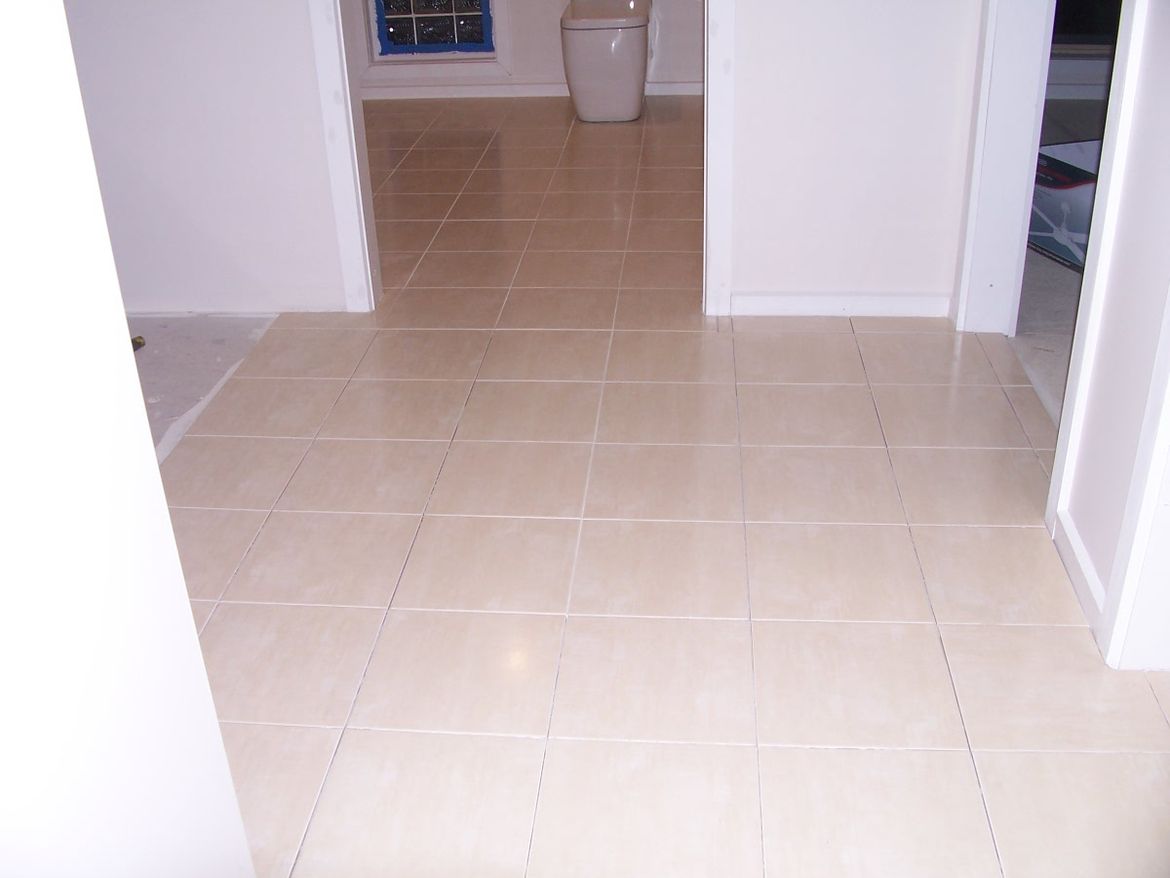 #2. Tiling outside toilet.JPG
