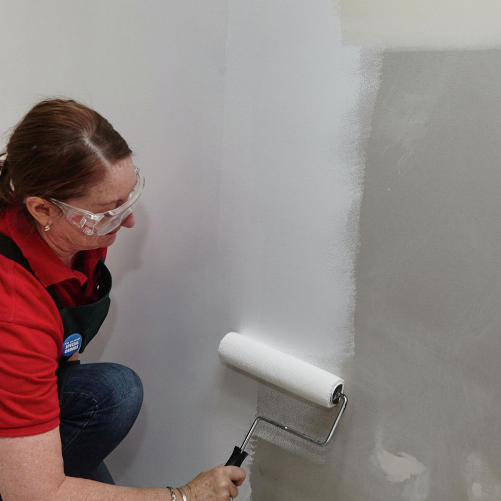 A coat of primer seals the surface and gives the paint a stable base to adhere to