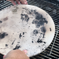 5. Position your pizza stone in the middle of the grill.png