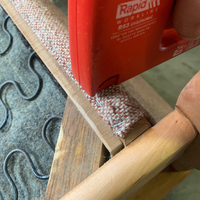 6.2 Stapling upholstry onto wooden sections.png