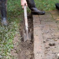 A trenching shovel is ideal for creating drains