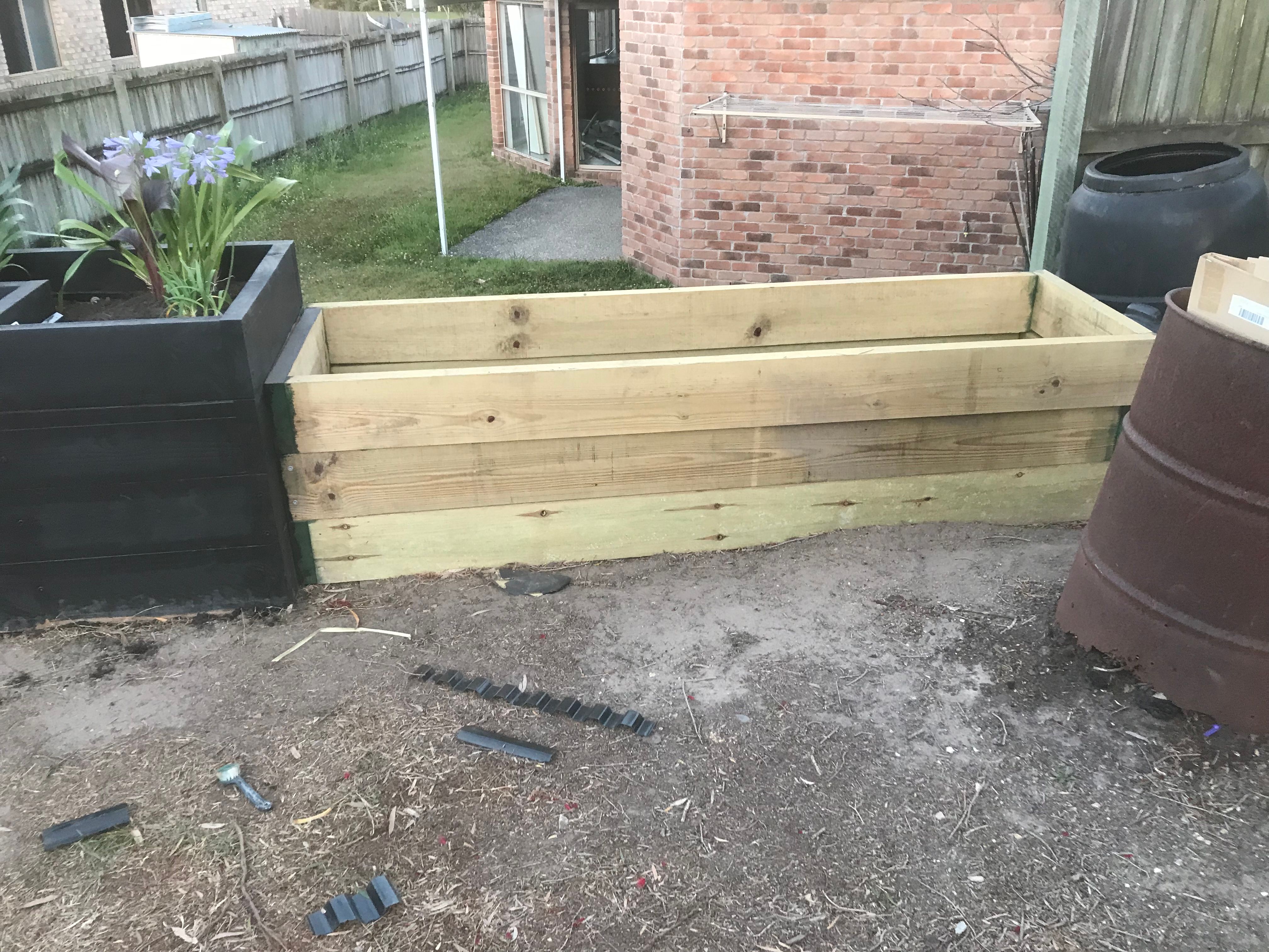 Backyard transformed with planter boxes Bunnings community