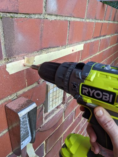 Use masking tape to mark the depth of your drill bit AS WELL as on the brick to avoid slippage and helps with brick dust too!