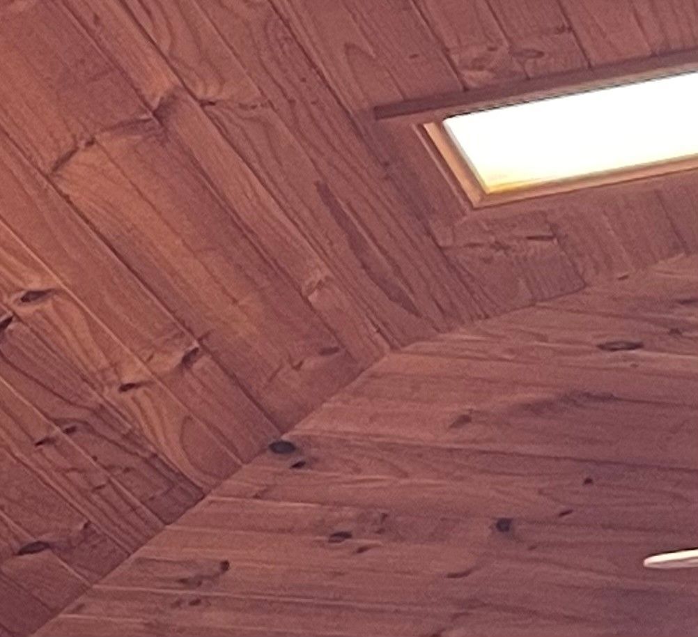 ceiling cladding attached rafters using liquid  nails and then nails for support untill it hardens.