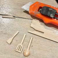 8.3 Cutting utensil shapes from balsa wood.jpeg