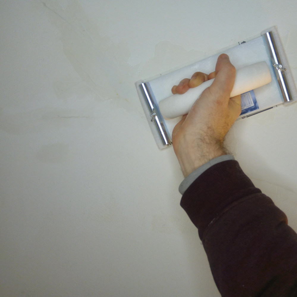 6.1 Sanding excess plaster.png