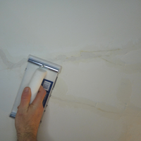 4.1 Sanding plaster back flush with ceiling.png