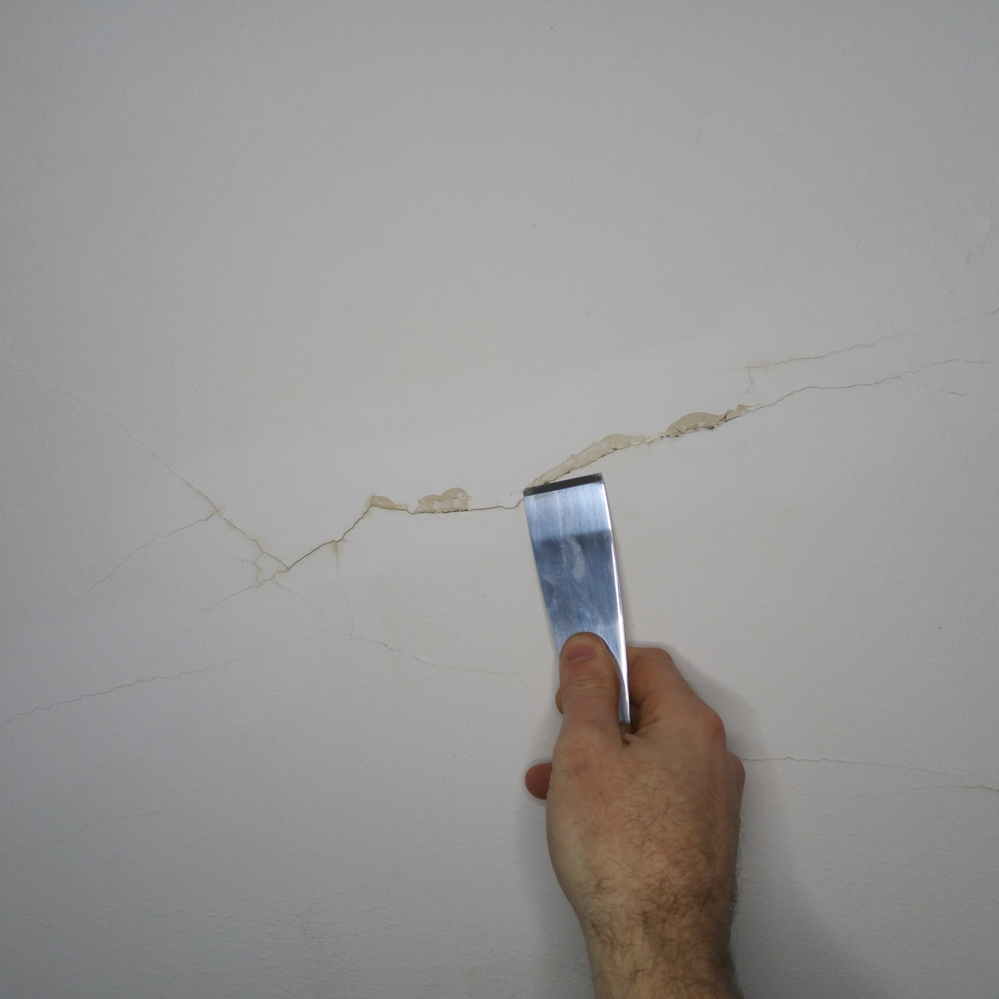 2.2 Chipping loose paint away.png