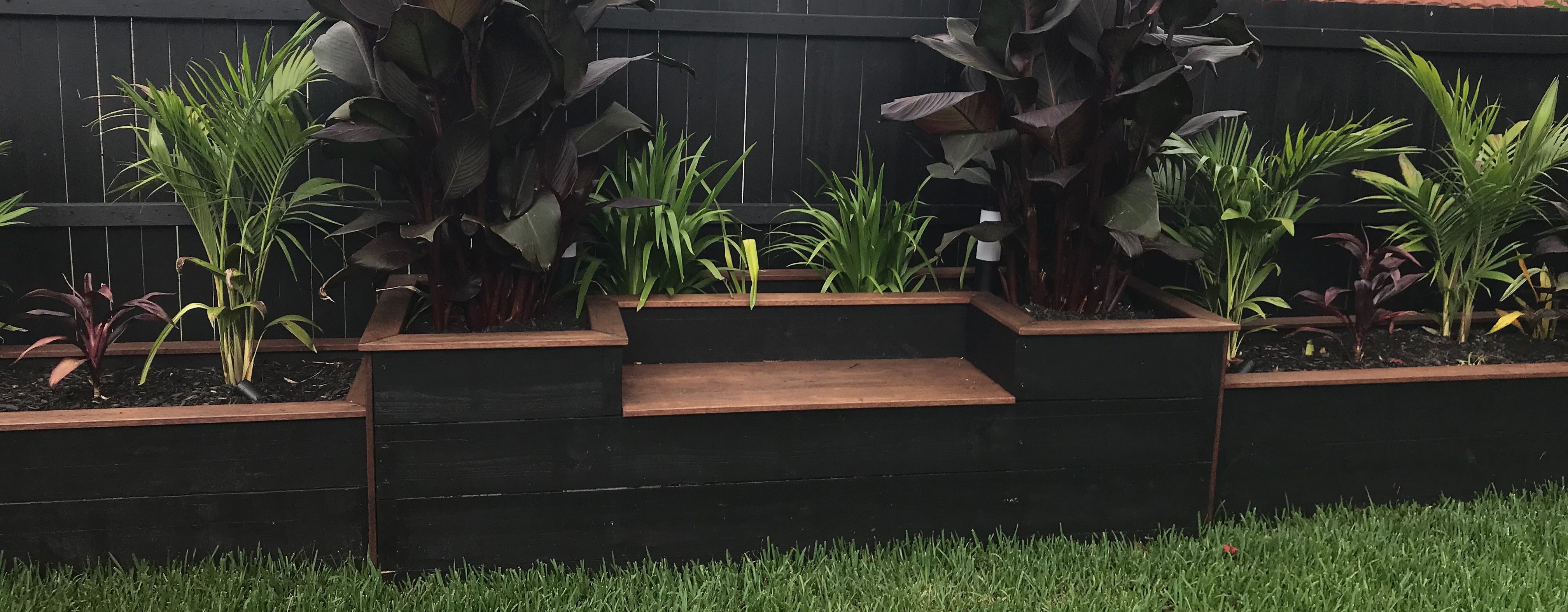 Backyard transformed with planter boxes Bunnings community