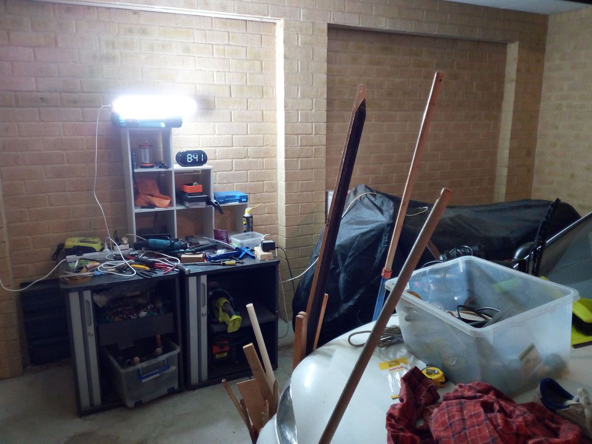 Some shelves could work, although NOTHING  goes above the bike!