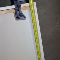 3.1 Fasten timber lengths to drawer sides using a clamp.png