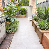 Small yard makeover with pavers and planter boxes