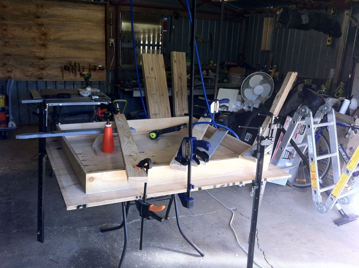 An upside-down top being clamped up.