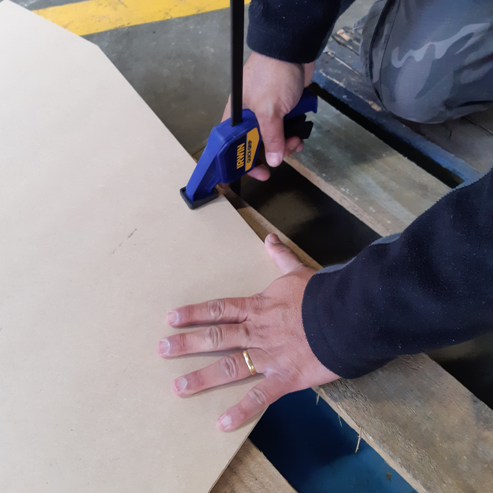 2.1 Clamping sheets down.png