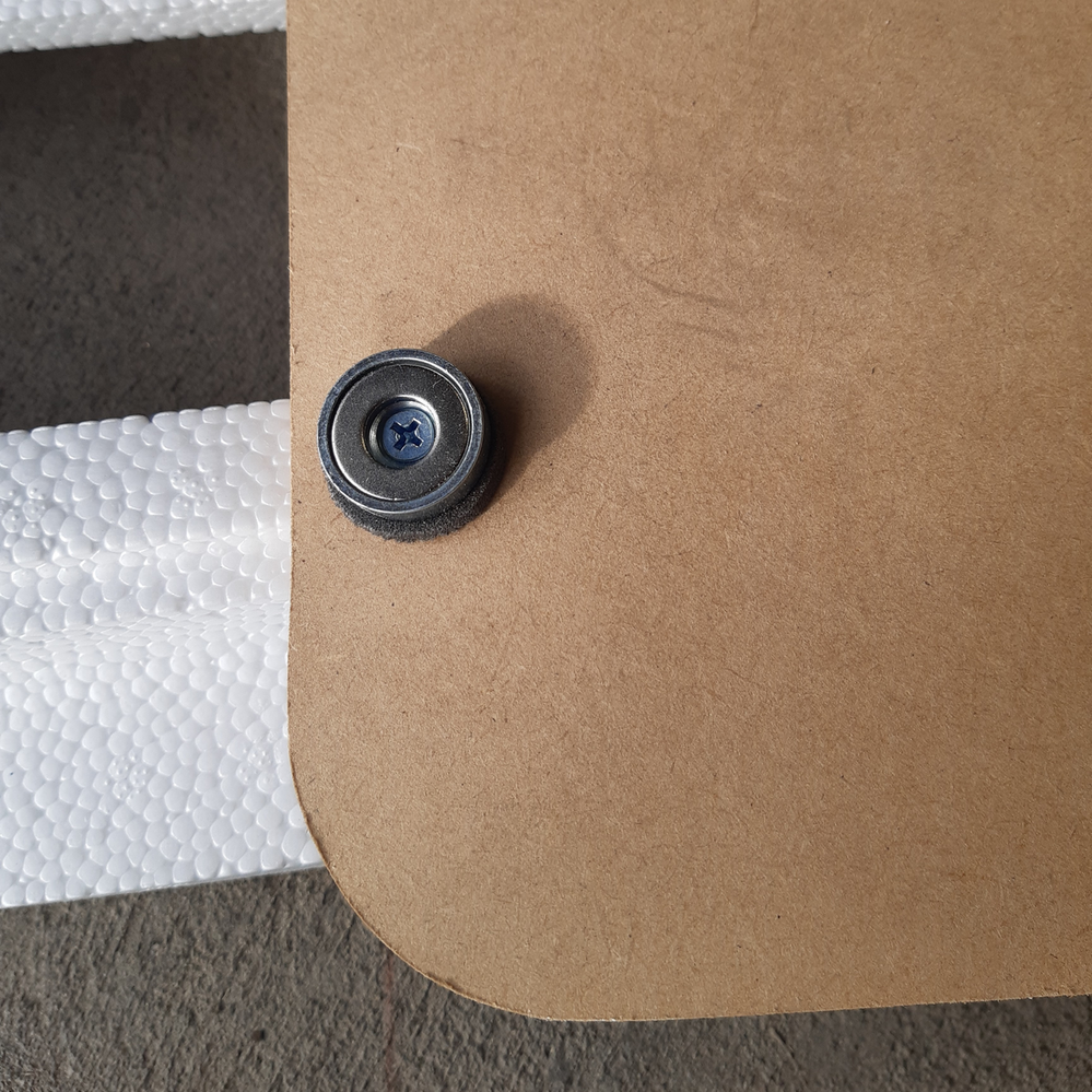 6.6 Attaching magnets to access panel.png