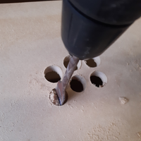 8.5 Drilling button holes.png