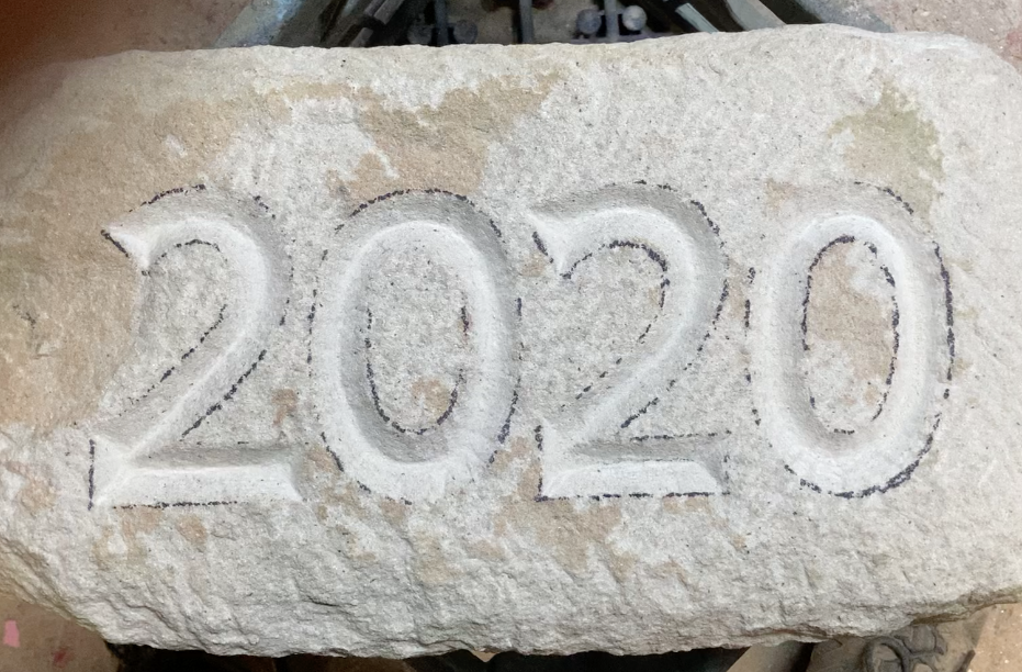 stone-carved-with-date.png