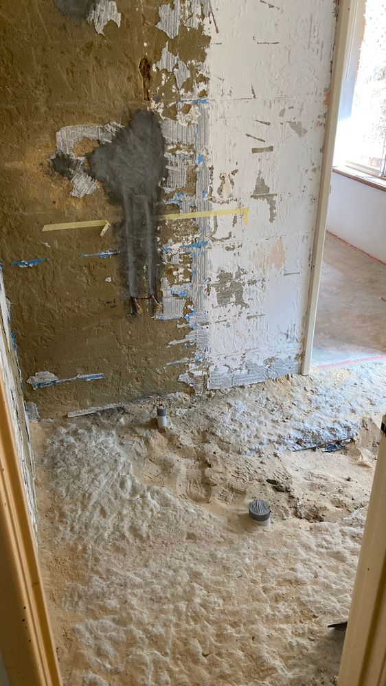Bathroom floor showing channel to floor waste