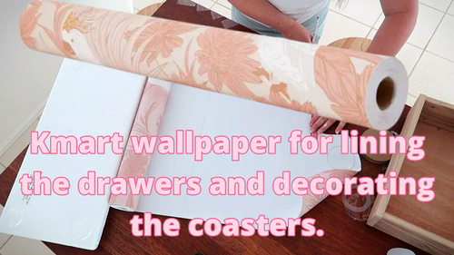 I also lined the drawers with the same wallpaper.