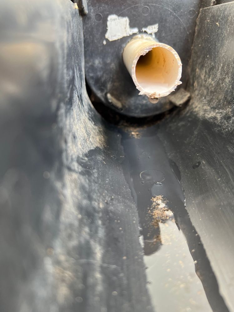AC drain pipe, gap at bottom of drain suggests source of leak