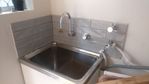 laundry-sink-with-new-backsplash.jpg