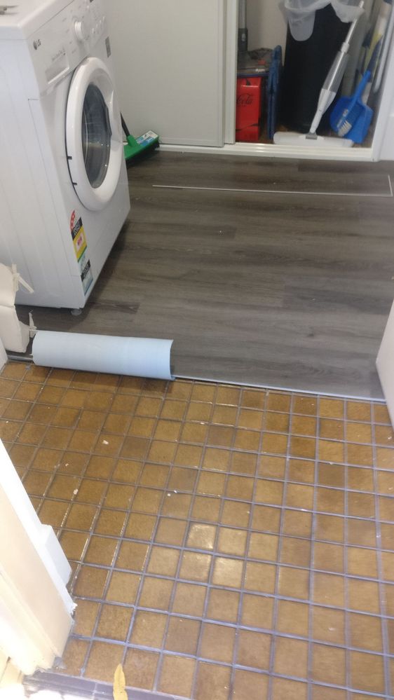 vinyl-flooring-over-laundry-tiles.jpg