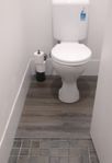 vinyl-flooring-over-toilet-tiles.jpg