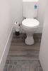 vinyl-flooring-over-toilet-tiles.jpg