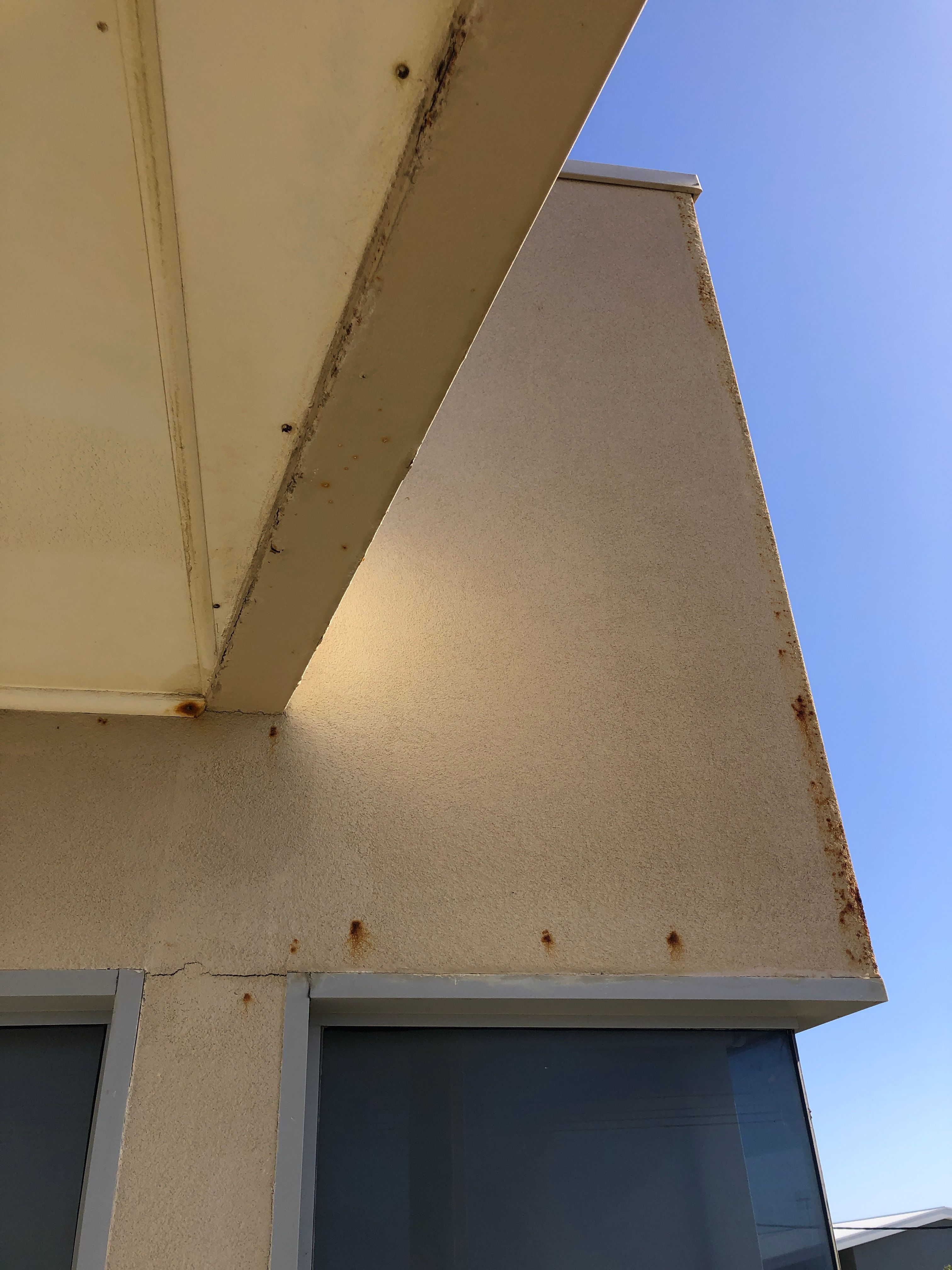 How to paint rust seeping through render... Bunnings community