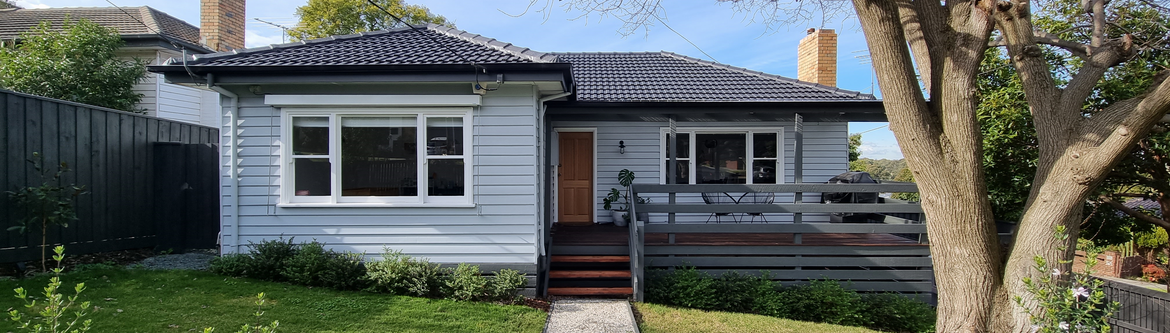 Tired weatherboard home renewed with paint (2).png